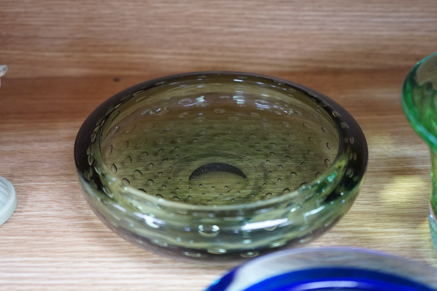 A Whitefriars green glass ‘bubble’ dish, a Costa Boda blue/green bowl and a Murano dish (3) tallest 10.5cm